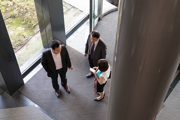 istock business people entering into the lobby 539236766