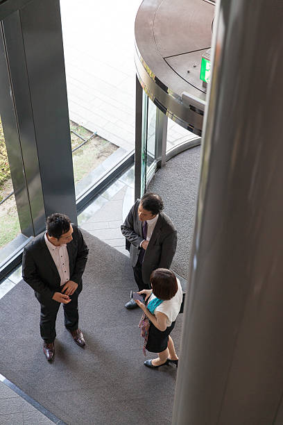 istock business people entering into the lobby 539236824