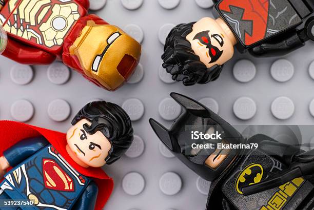 Four Lego Super Heroes Minifigures On Gray Baseplate Stock Photo - Download Image Now