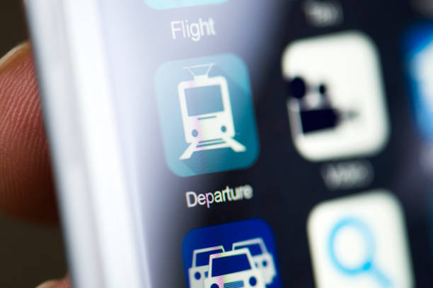 istock Hand holding phone, departure app on screen 539238282
