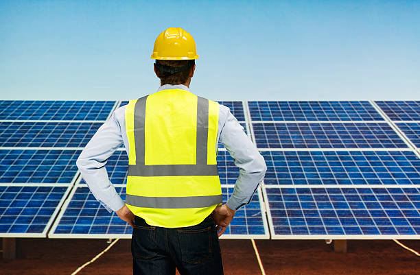 istock Rear view of solar worker standing outdoors 539239148