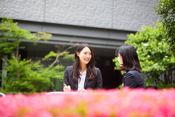 istock Japanese business woman sit outdoors for a meeting 539242570