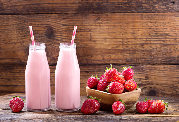 istock bottles of strawberry smoothie 539243154