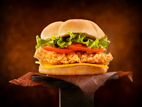 Crispy Chicken Burger with Cheese, Lettuce and Tomatoes