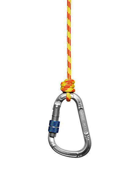 Prusik on carabiner Carabiner with clipping path hanging strapped on prusik. Isolated on white. carabiner stock pictures, royalty-free photos & images