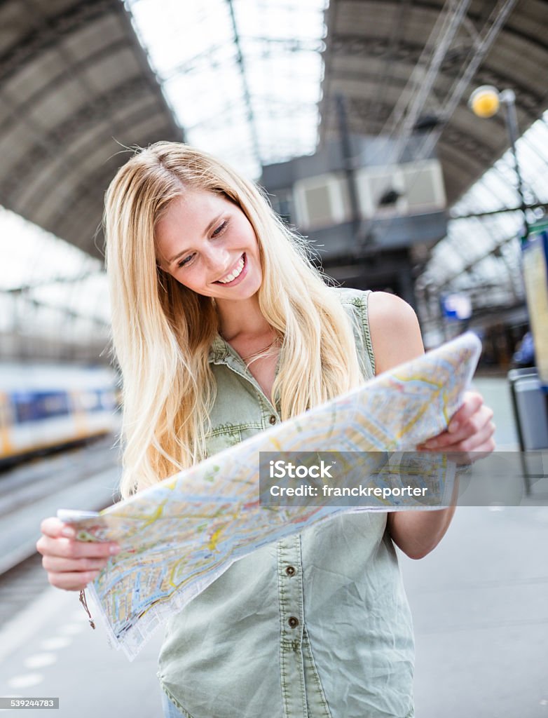 tourist in amsterdam looking map of the city 20-29 Years Stock Photo