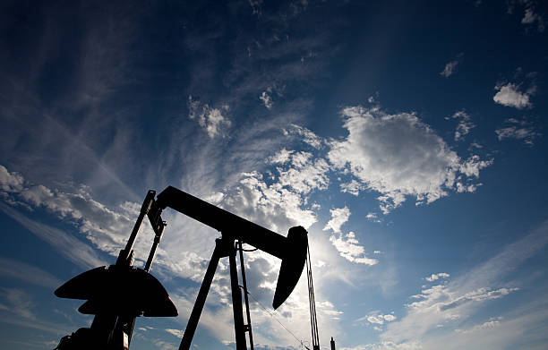 prairie pumpjack silhouette - okotoks stock-fotos und bilder