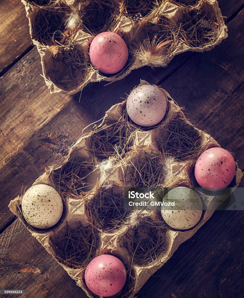 Colorful Easter Eggs Decorated on Wooden Background Colorful Easter eggs on wooden background. They can be painted in various colors and can be given on Easter or springtime. Decorating Easter Eggs is fun and creative activity which you can do with your family. Colored Easter Egg is a universal symbol of Easter. 2015 Stock Photo