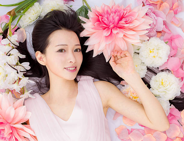 istock girl in flowers sleeping spa 539245425