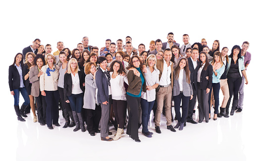 Crowd of happy business people standing embraced and looking at the camera. Isolated on white.
