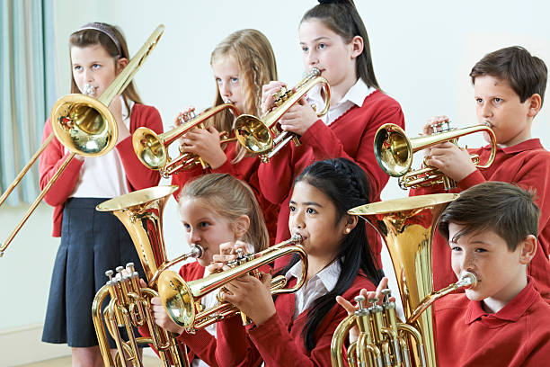 istock Group Of Students Playing In School Orchestra Together 539246196