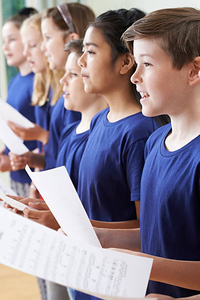 istock Group Of School Children Singing In Choir Together 539246368