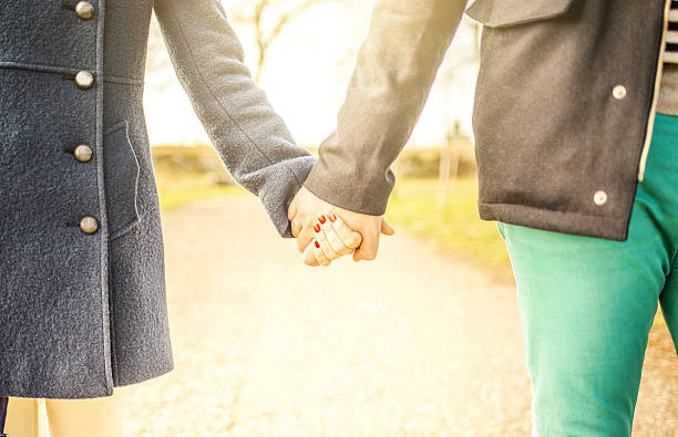 istock Holding hands, caucasian couple in love 539246383