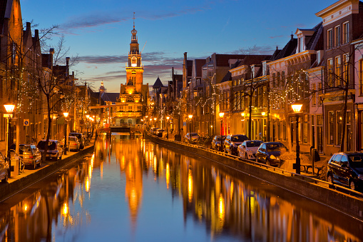 A canal and the tower of the Waag in the city of Alkmaar, The Netherlands.
