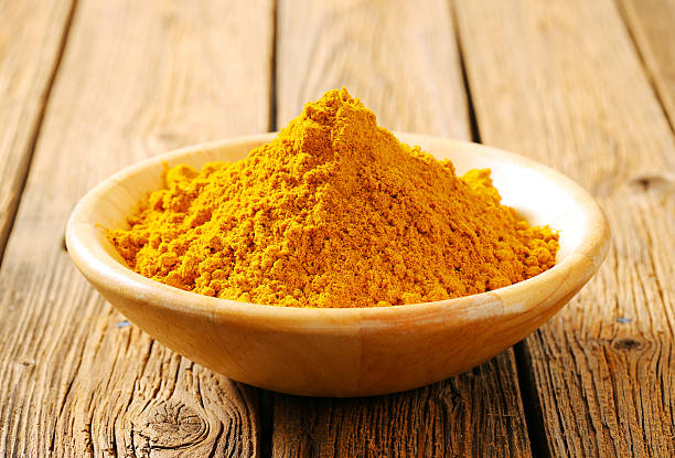 Heap of curry powder stock photo