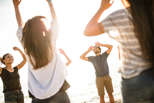 istock friends playing volleyball on the beach 539259187