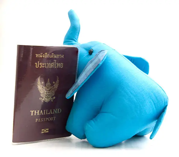 Photo of Thailand passport and silk elephant