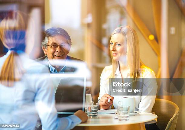Business Meeting At The Coffee Bar Stock Photo - Download Image Now - Active Seniors, Adult, Beautiful People