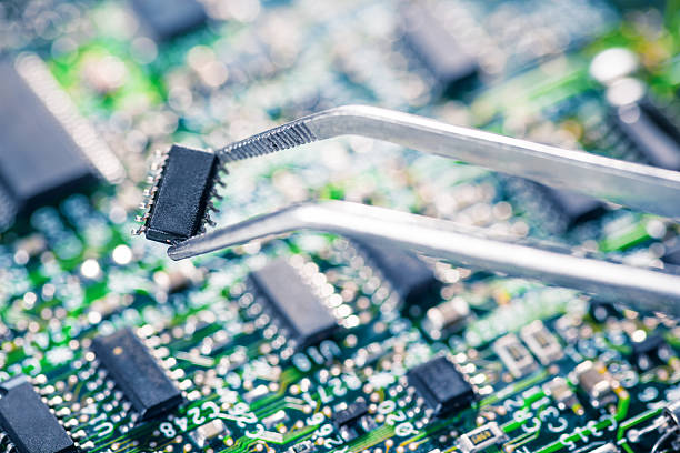 istock Technician holding chip in tweezers 539261309