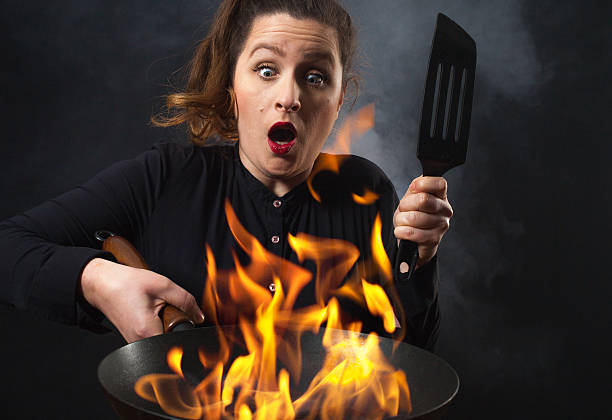 istock Fire cook woman - wok cooking 539268941