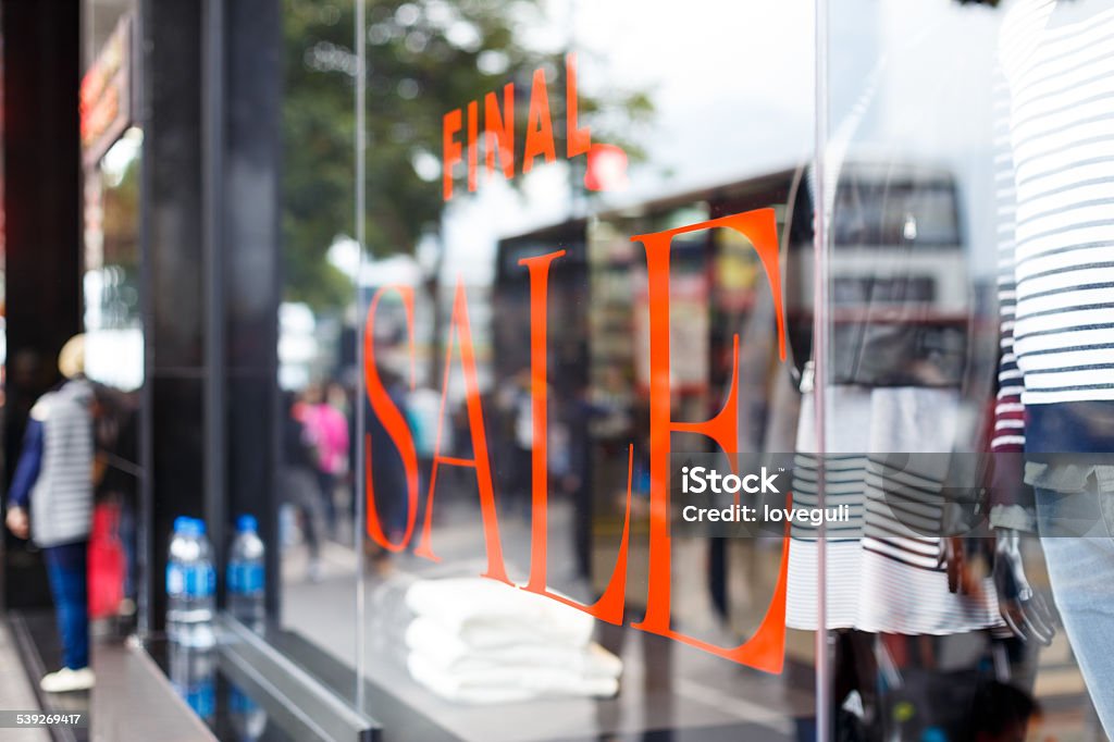 sale sign on display window of clothes shop sale sign on display window of clothes shop, modern commercial theme. Arts Culture and Entertainment Stock Photo