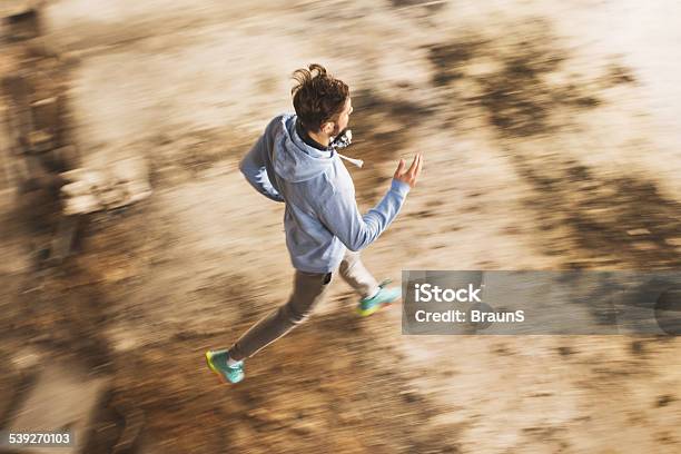 High Angle View Of A Man Running In Blurred Motion Stock Photo - Download Image Now