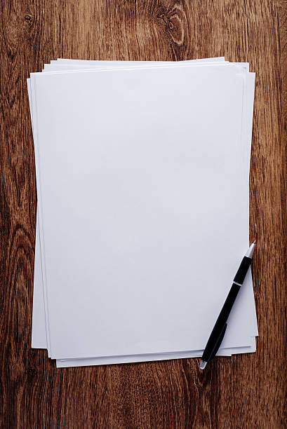istock White Blank Papers and Pen on Wooden Table 539270285