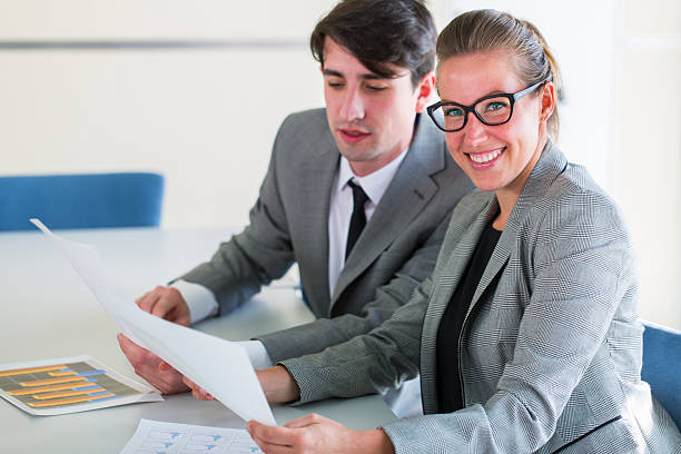 istock Young business man and cute woman chatting,using digital tablet 539270511