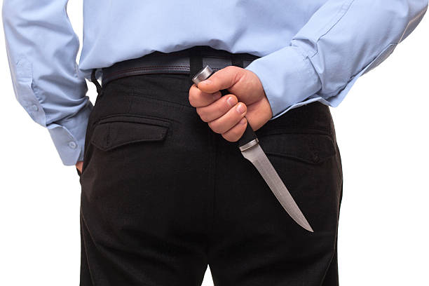 istock Businessman with knife behind his back 539270893