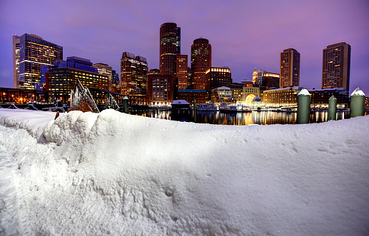Snowiest Winter in Boston's History. More than 9 feet of snow shutdown all subway and rail services leading to the activation of the National Guard to help clear the snow. Photo taken along the harborwalk in the  South Boston southie neighborhood. Boston is the capital and largest city in Masssachusetts