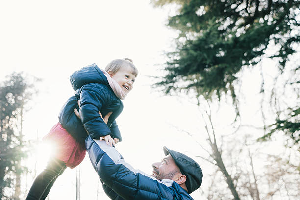 istock Father Swinging His Daughter 539271011
