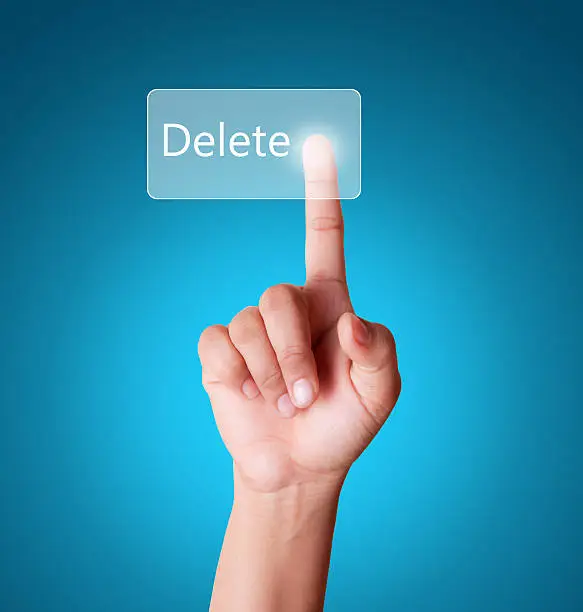 Photo of Finger touching delete button on a touch screen