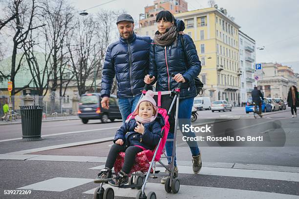 Happy Family Crossing The Street Stock Photo - Download Image Now - Baby Stroller, City, Family