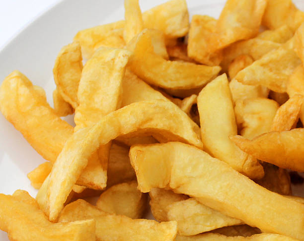 istock Image of greasy chips from takeaway fish and chip shop 539280385