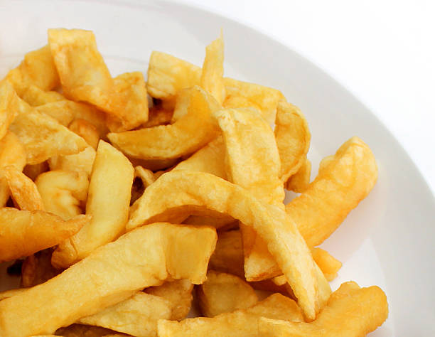 istock Image of greasy chips from takeaway fish and chip shop 539280387