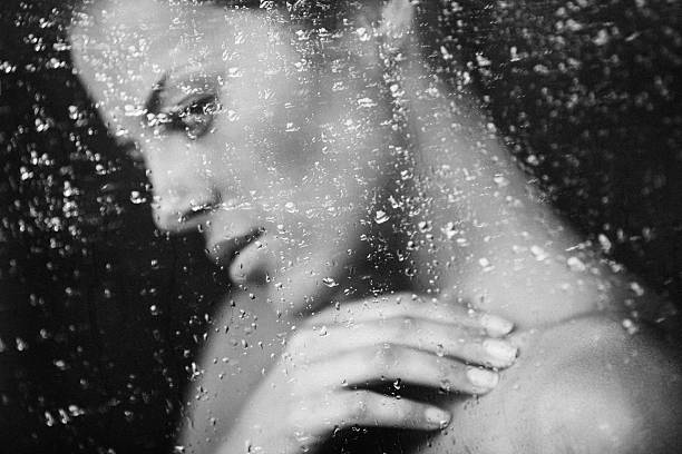 istock Beautiful girl behind a window 539280509
