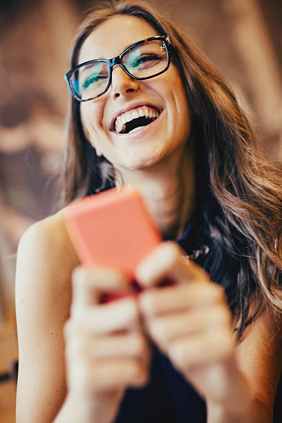 istock Happy young woman texting 539280809