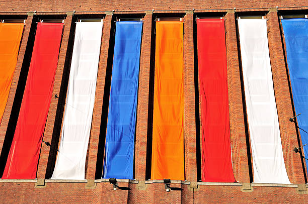 Building front decorated with red, white, blue (Dutch flag colours) and orange (national colour of the Netherlands) on Queen’s Day (Koninginnedag).