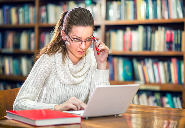istock Young female student in the library 539281505