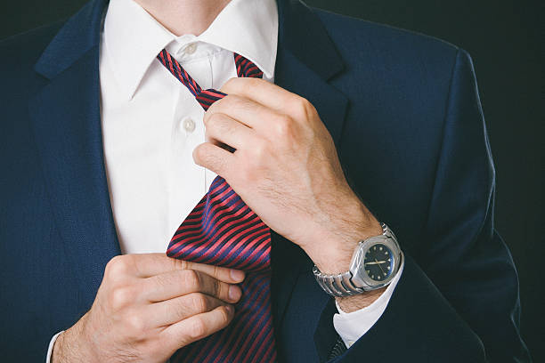 istock Businessman tieing a tie 539282051