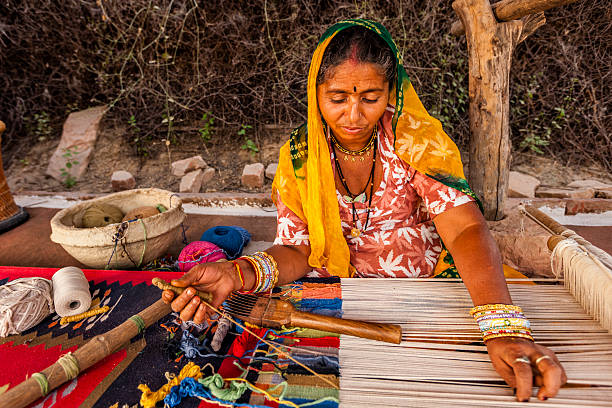 Indian woman weaving textiles (durry) in Rajasthan