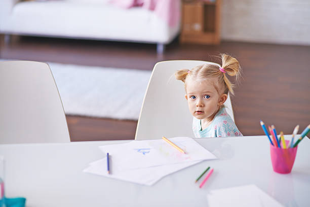 istock Little girl by desk 539282527