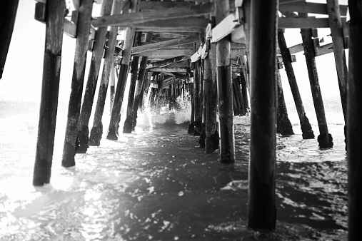 Detail view of the structure of the underside supports of the San Clemente Pier located in Orange County, California.  The image was processed in black and white.