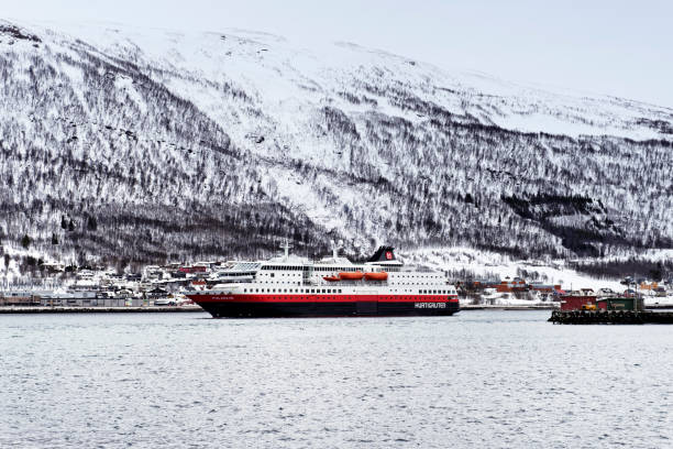 Tromso,Norway - February 28, 2015: The Hurtigruten vessel MS Polarlys is arriving in the harbour of Tromso, a city in the Troms County in Northern Norway and located above the Arctic Circle.