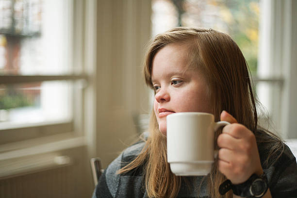 Down syndrome, girl, breakfast, drink