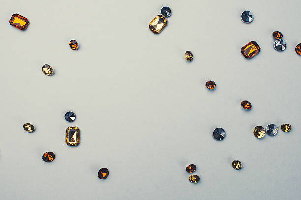 istock Close up of orange rhinestones gems 539291707
