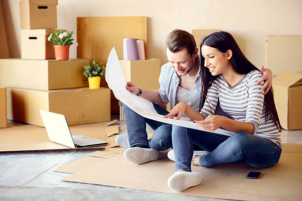 istock young couple in a new apartment with boxes for moving 539292665