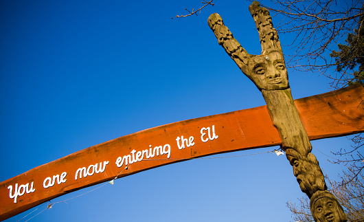 Copenhagen, Denmark - April 02, 2013: Sign indicating the boundary line between the self-proclaimed autonomous town of Christiania and the European Union.