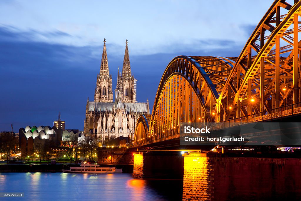 Cologne, Germany The illuminated Cologne Cathedral and Hohenzollern Bridge. Long exposure at night. Germany Stock Photo