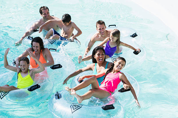 istock Group of people at water park on lazy river 539294819
